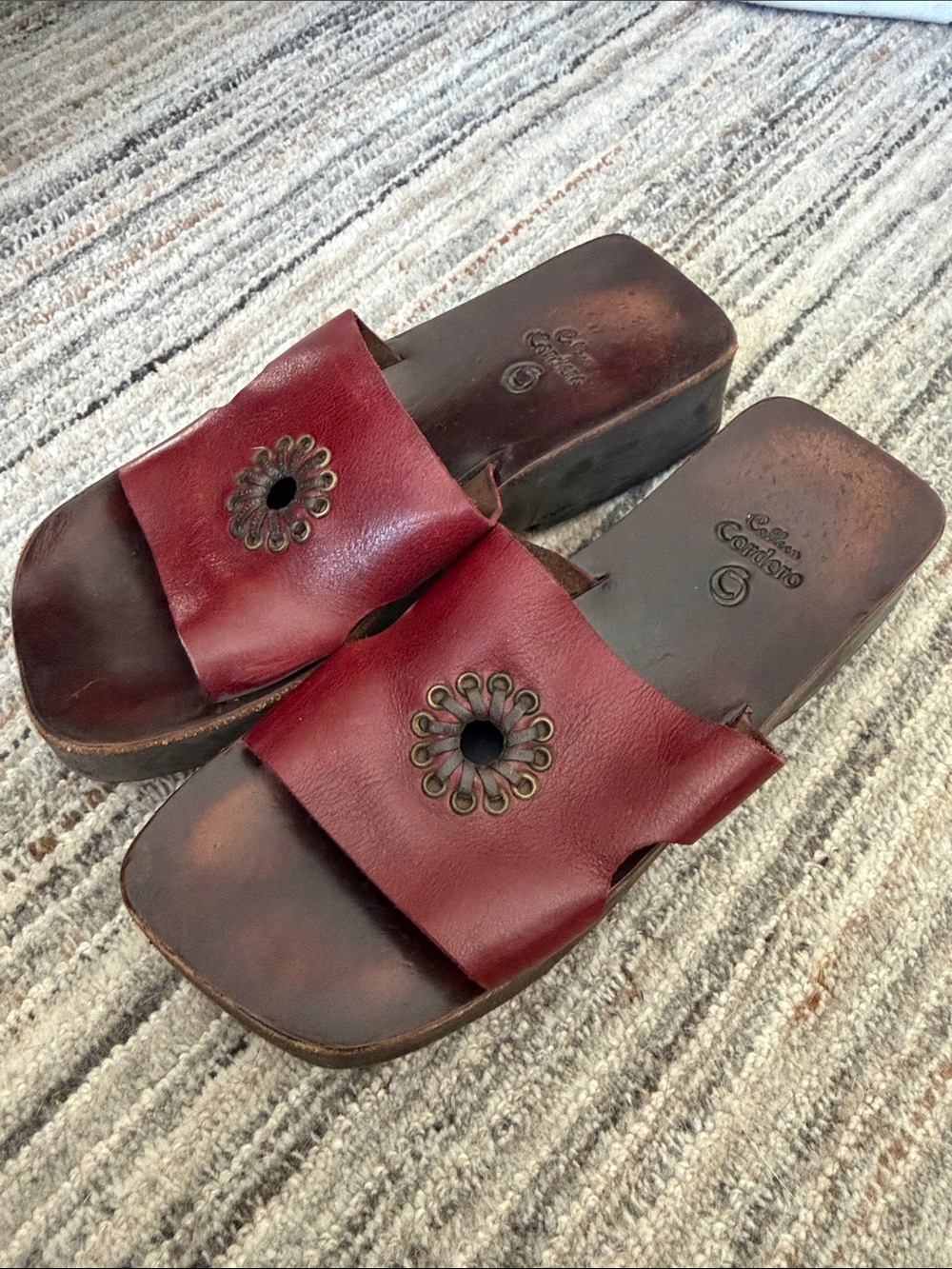 Cordani Burgundy Leather Slide Sandals with Decorative Metal Rosettes